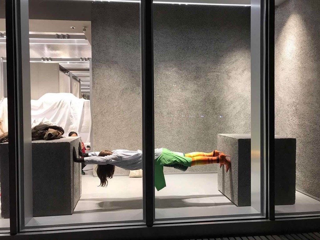 Figure held between two blocks in the Colette window, Paris
