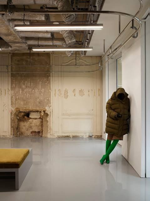 Figure in a puffer coat against the wall, Balenciaga, avenue Montaigne, Paris