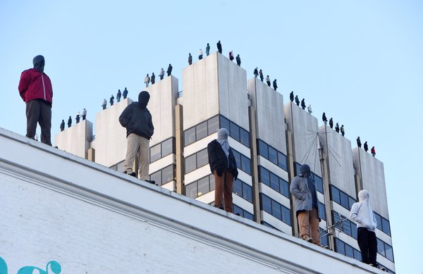 Figures on the roof edge of Studio 8