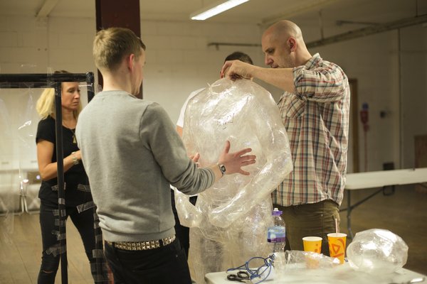Casting a figure with a family member in the studio